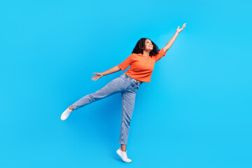 Full length photo of dreamy happy joyful afro american young woman hand empty space isolated on...