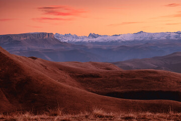 Naklejka premium Autumn mountain landscape in the haze. Mount Elbrus in the background