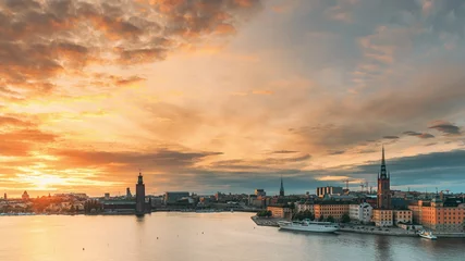 Foto op Canvas Stockholm, Sweden. Skyline Cityscape Famous View Of Old Town Gamla Stan In Summer Evening. Famous Popular Destination Scenic UNESCO World Heritage Site. Popular City Hall, Riddarholm Church In Sunset. © Grigory Bruev