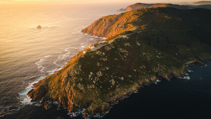 Cape fisterre the end of the earth for the ancient tradition, aerial view of rock cliff formation...
