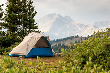Tent against the background of forest and mountains. - obrazy, fototapety, plakaty