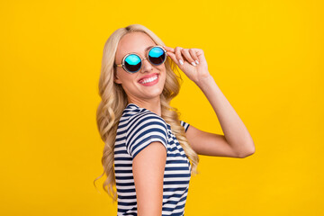 Photo portrait woman wearing casual clothes sunglass smiling got good mood isolated vivid yellow color background