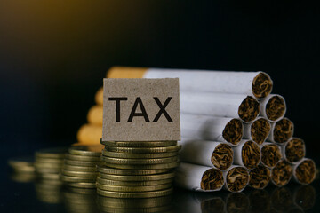 Cigarettes.Tobacco Cigarettes and TAX word on black background.Cigarettes and TAX concept. Smoking...