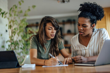 Diverse coworkers, leaving their signatures on a contract