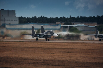 Modern military jet fighter at the runway ready to take off