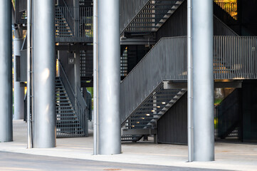 Obraz premium staircase with metal stairs and railings leading upwards, an element of urban architecture