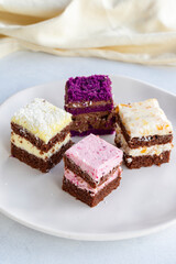 Mini cake desserts in different flavors. Delicious cakes on a white background. Story format