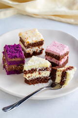 Mini cake desserts in different flavors. Delicious cakes on a white background. Story format