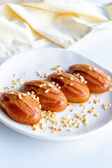 Delicious turkish sweet sekerpare on served. Traditional Turkish dessert sekerpare on a white background. Story format