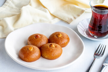 Delicious turkish sweet sekerpare on served. Traditional Turkish dessert sekerpare or badempare on...