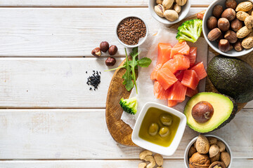 Keto diet concept - good fat sources on white wood background