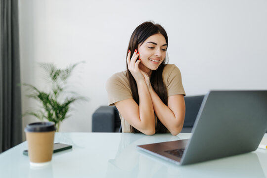 Young Woman using working on laptop and working from home