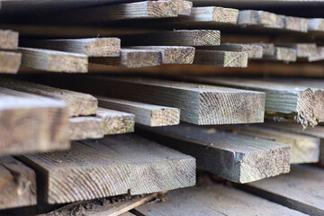 Stacked wooden planks on the street