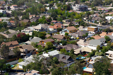Aerial view of residential neighborhood homes in Santiago city, Chile. Overpopulation concept