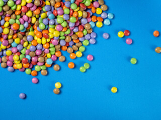 multicolored chocolat candy background, copy space, close up