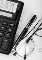 Calculator with Pen, Eyeglasses and Numbers