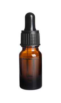 Glass bottle of essential oil on white background