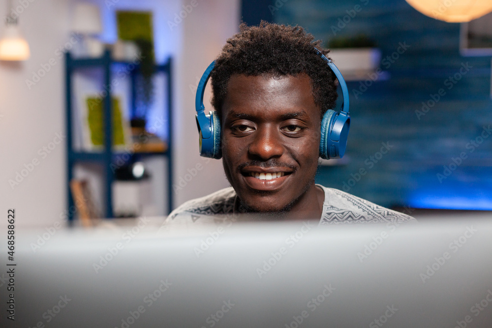 Poster african american young employee using computer for remote work typing management ideas on keyboard. 