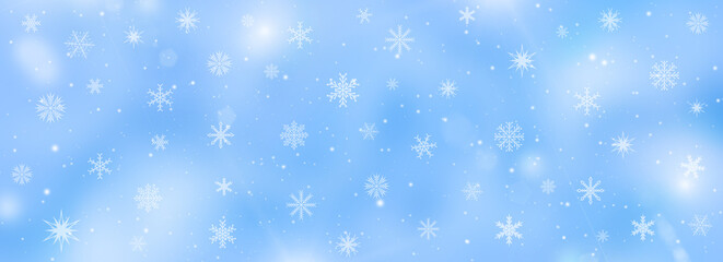 Soft blue winter background with snowflakes and falling snow. Christmas and New Year banner