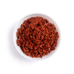 spicy maldives fish chips or flakes condiment, made with chili peppers, tomato, ginger, garlic and salt, fresh food in a cup or bowl, taken from above