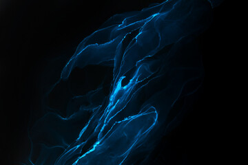 Abstract blue electric wave on black technology background. Neon light paint in water, acrylic...