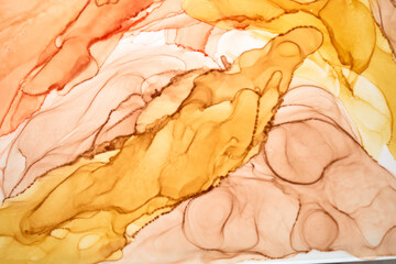 Abstract ocher watercolor background. Yellow orange brown paint stains and spots in water, luxury...