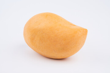 Whole orange thai mango isolated on white background, clipping path