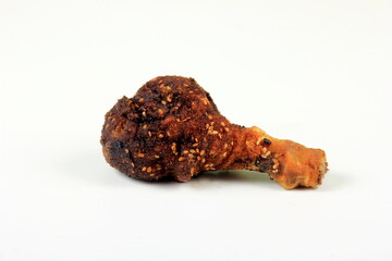 One Chicken leg baked in a dough on a white background
