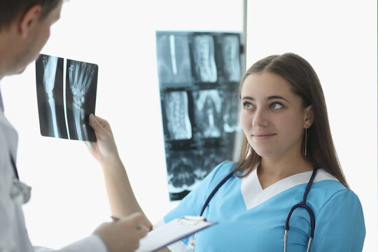Doctors look at xrays in medical office
