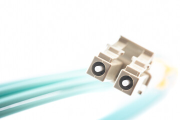 Macro of duplex fiber optical patchcord cable type LC on white background