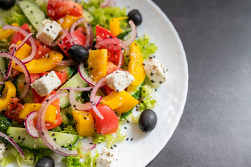 assorted food parmesan cheese with grapes and blue cheese and honey on a plate in a restaurant