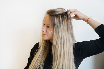 Fototapeta premium Natural Hair extensions blonde woman on a white background. 