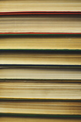 Background,stack of old books with yellowed pages.