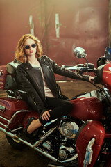 Plakat stylish girl in a garage