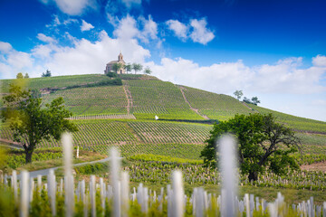 Church of Fleurie village and vineyards of Beaujolais