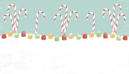 Candy canes and gumdrops in a cut paper style with textures and copyspace
