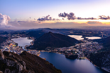 The city of Lecco, on Lake Como, photographed after sunset from Pian Dei Resinelli, with Brianza...