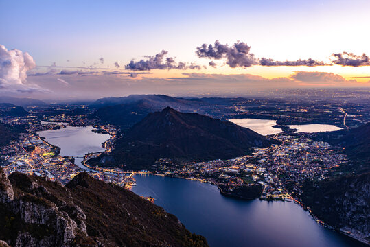 The city of Lecco, on Lake Como, photographed after sunset from Pian Dei Resinelli, with Brianza and its lakes in the background.