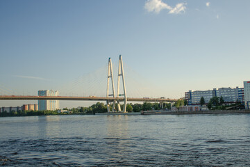 Fototapeta na wymiar Modern road Vantovyi bridge across the river. Summer travel concept