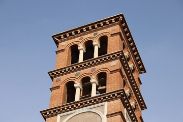 Fototapeta na wymiar Bell tower of the church of the Coppede district in Rome, Italy
