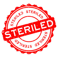 Grunge red steriled word round rubber seal stamp on white background