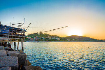 Trabocco San Giacomo in Ortona at sunset, Abruzzo. Trabucco a sort of Trebuchet, traditional wooden...