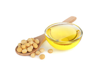 Glass bowl of oil, soybeans and wooden spoon on white background