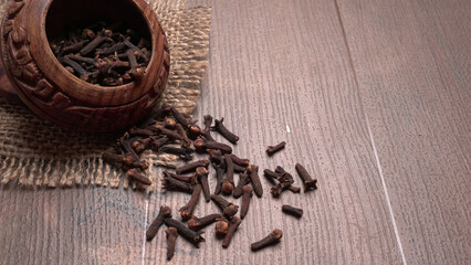 Cloves on vintage wooden background.