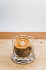 tasty delicious bio pastries and biscuits in a glass jar on a rustic wooden background