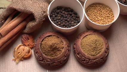 Collection of indian Spices and herbs. Food and cuisine ingredients on wooden background.