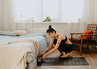 Fototapeta na wymiar woman preparing for yoga at home