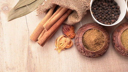 Collection of indian Spices and herbs. Food and cuisine ingredients on wooden background.
