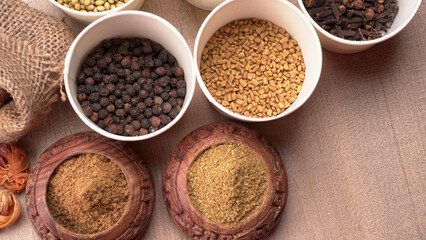 Collection of indian Spices and herbs. Food and cuisine ingredients on wooden background.