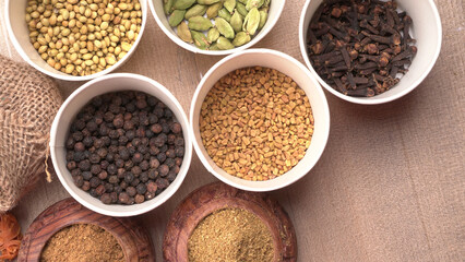 Collection of indian Spices and herbs. Food and cuisine ingredients on wooden background.